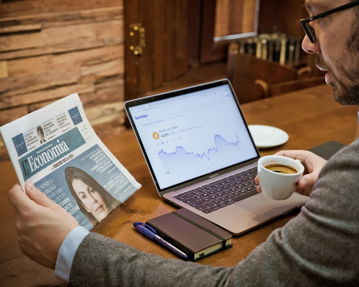 Practice owner reading industry news and reviewing reports